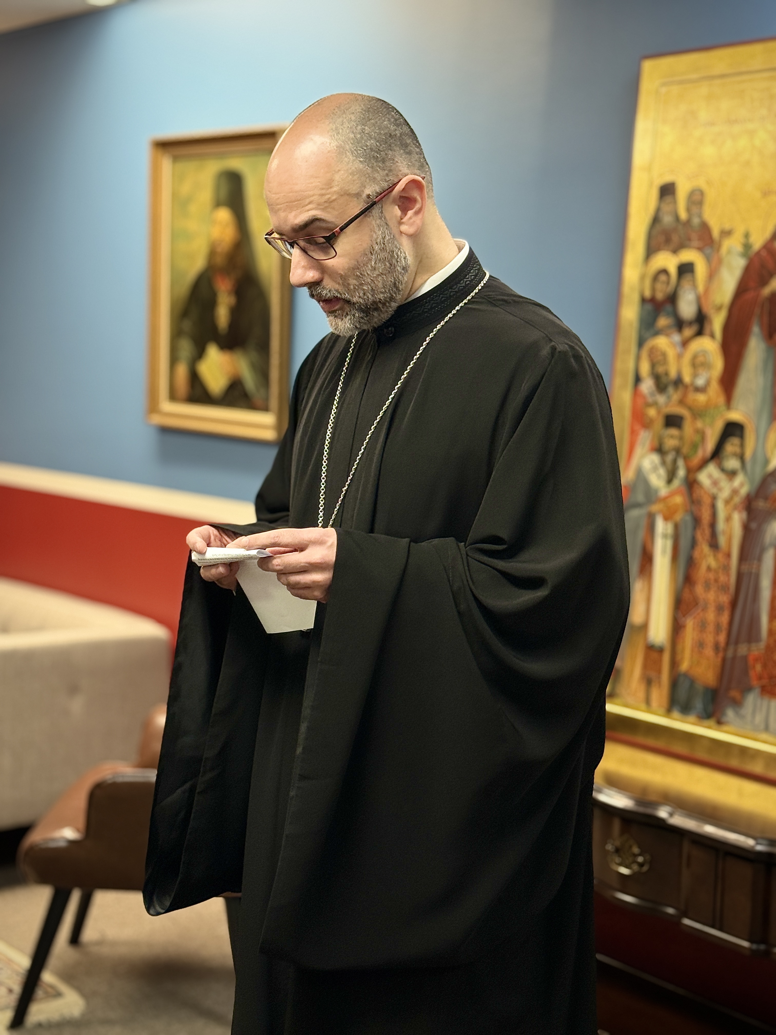 Fr. Alessandro giving remarks after his confirmation. Note the recently commissioned icon of All-Saints of North America