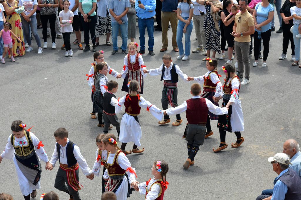 Children join in traditional dancing for the feast, Ranilović, Serbia.
