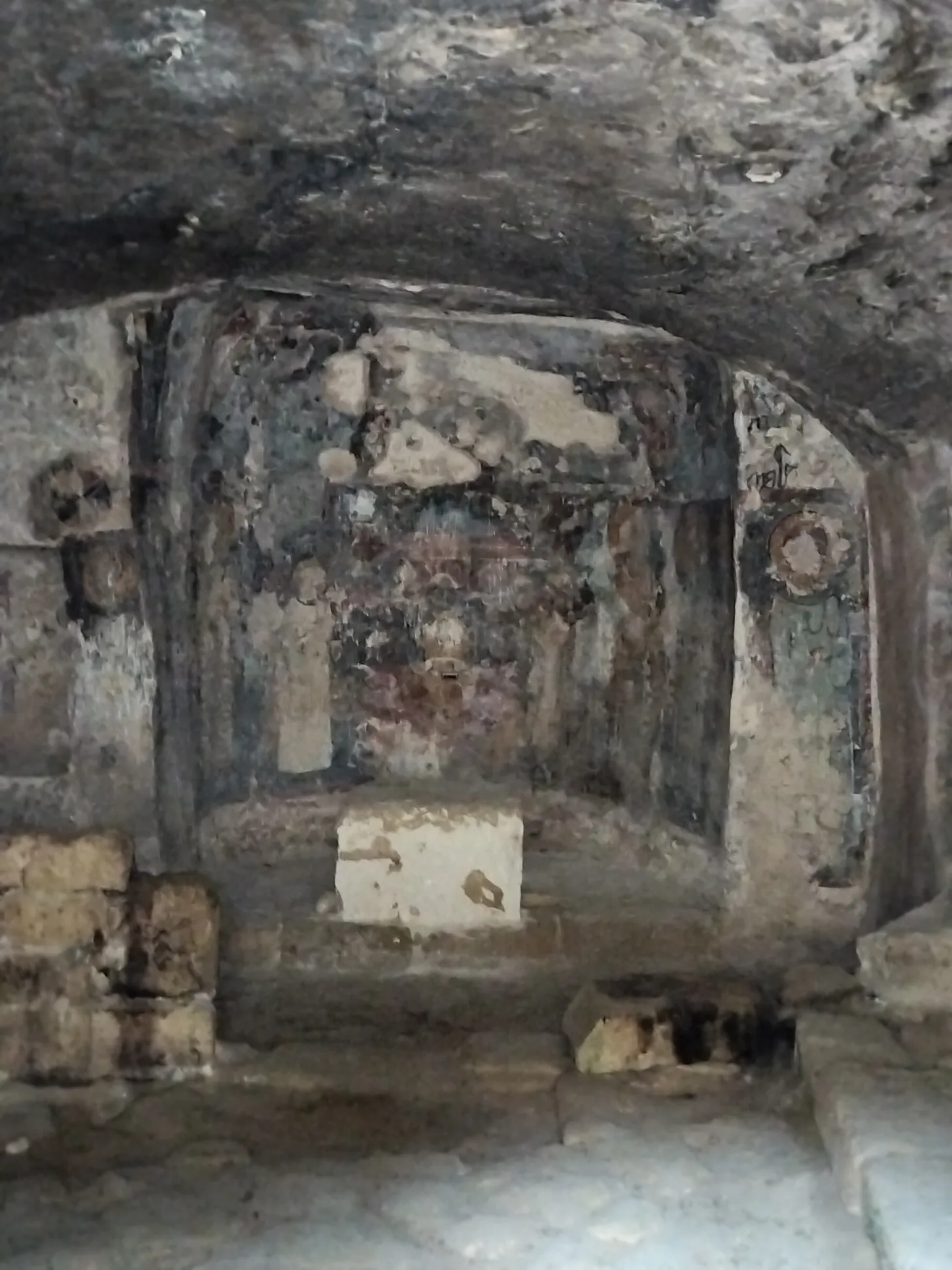 The Agia Solomoni Catacomb Church. Note the faces of the icons have been removed. Whether this is simple wear or the result of the Iconoclastic period, I do not know. The remnants of the Holy Table.