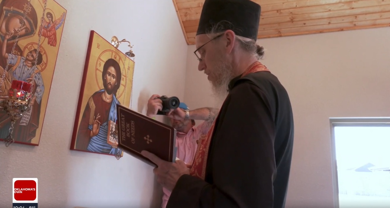 The Teague's parish priest blesses the new chapel. 