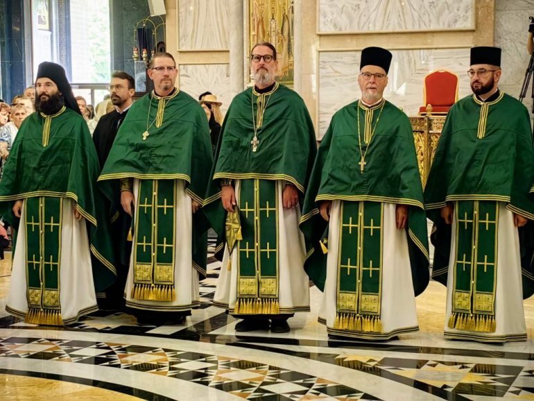 Fr. John Parker, second from left, with Fr. Josiah Trenham to his left.